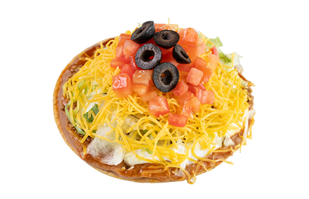 A taco with cheese, tomatoes and olives on top.