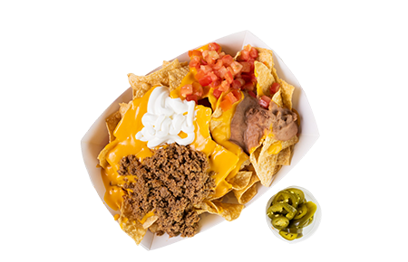 A bowl of food with chips, cheese and meat.